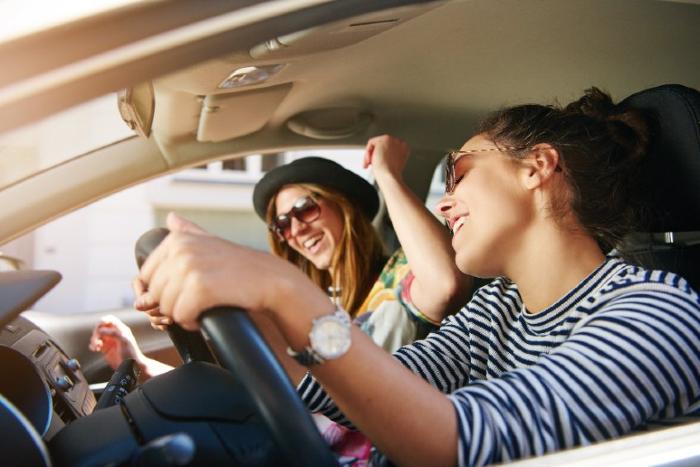women in car with power window problems