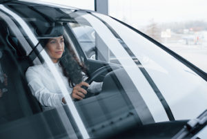 woman driving with new car windshield