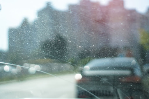 Car Windshield Needing Cleaning & Maintenance