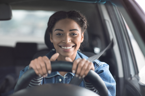 woman driving safely after a windshield ADAS calibration